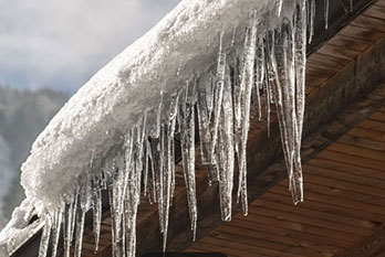 Ice Dam on house with improper attic insulation